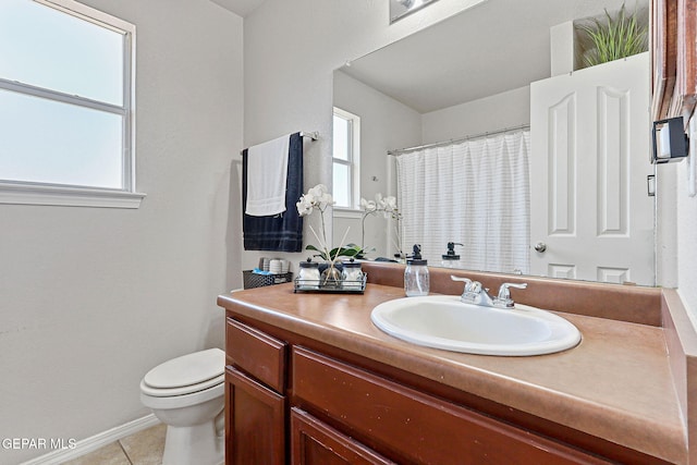 513 Bogota Pl, El Paso, TX 79928 - bathroom featuring toilet, vanity, tile patterned flooring, baseboards, and curtained shower