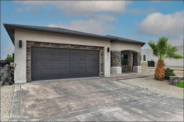 937 Grandevole Dr, El Paso, TX 79932 - prairie-style home featuring stone siding, stucco siding, concrete driveway, and an attached garage