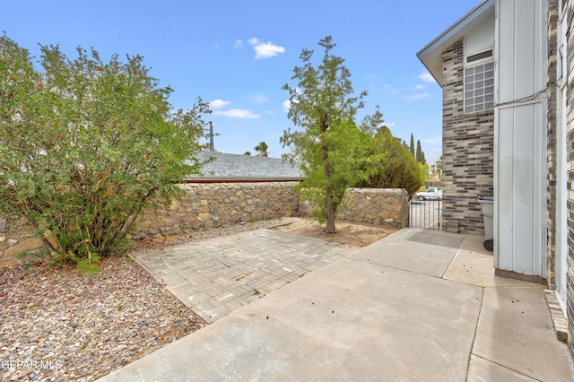 view of patio / terrace with a gate and fence