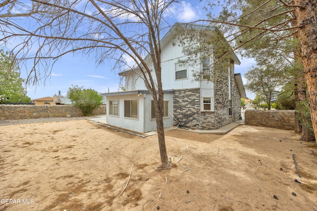 back of property with a fenced backyard