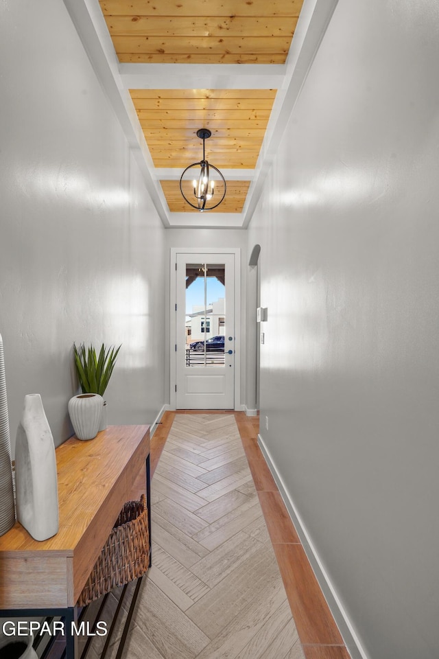 3817 Aspire Pl, El Paso, TX 79938 - doorway featuring wooden ceiling, a chandelier, baseboards, and light wood finished floors