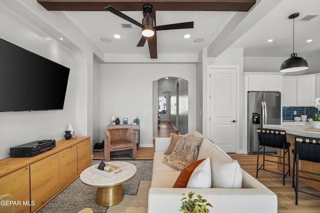 3817 Aspire Pl, El Paso, TX 79938 - living room with arched walkways, ceiling fan, and recessed lighting