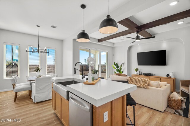 3817 Aspire Pl, El Paso, TX 79938 - kitchen featuring dishwasher, open floor plan, a sink, wood tiled floors, and beamed ceiling
