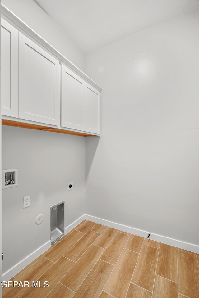 3817 Aspire Pl, El Paso, TX 79938 - clothes washing area featuring light wood finished floors, cabinet space, washer hookup, hookup for an electric dryer, and baseboards
