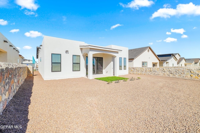 3817 Aspire Pl, El Paso, TX 79938 - back of house featuring stucco siding, a fenced backyard, and a patio