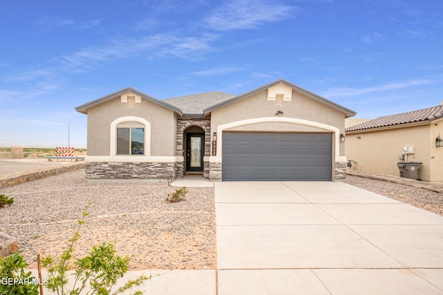 2240 Tierra Delmonte Dr, El Paso, TX 79938 - view of front of home featuring stucco siding, concrete driveway, stone siding, and a garage