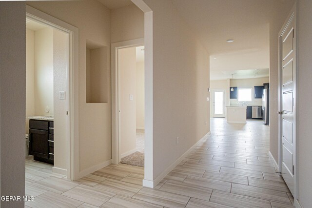 2240 Tierra Delmonte Dr, El Paso, TX 79938 - hallway featuring baseboards and wood tiled floors