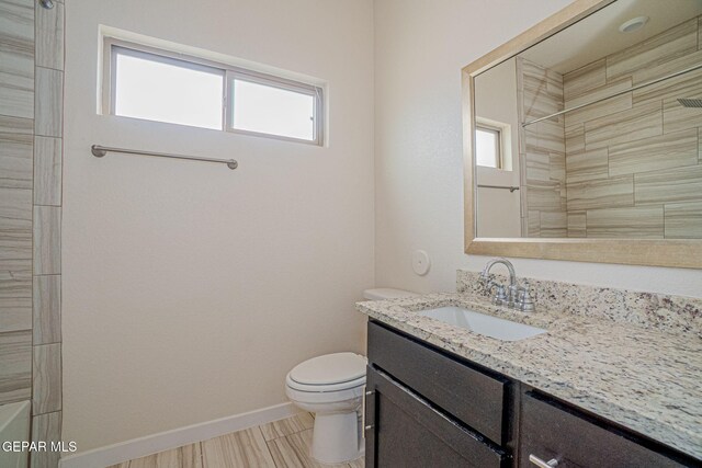 2240 Tierra Delmonte Dr, El Paso, TX 79938 - full bath with toilet, vanity, baseboards, and a shower