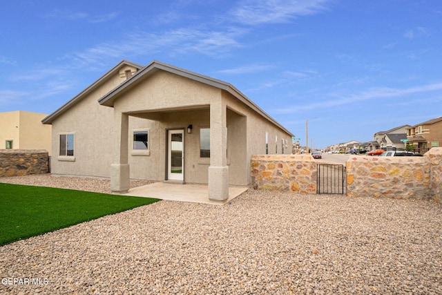 2240 Tierra Delmonte Dr, El Paso, TX 79938 - back of house featuring stucco siding and a patio