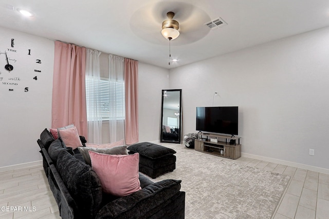 3516 Essence St, El Paso, TX 79938 - living room featuring a ceiling fan, light wood-type flooring, and baseboards
