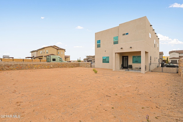 3516 Essence St, El Paso, TX 79938 - rear view of house featuring a fenced backyard, a patio, and stucco siding