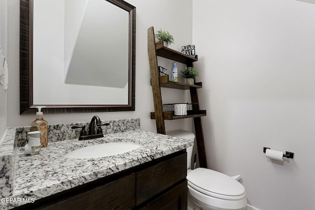 3516 Essence St, El Paso, TX 79938 - bathroom featuring toilet, vanity, and baseboards