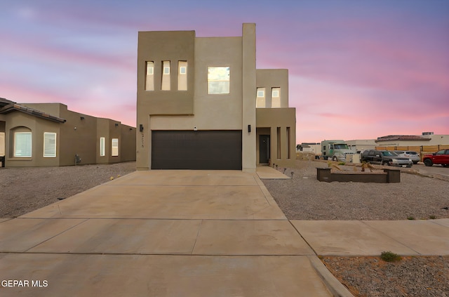 3516 Essence St, El Paso, TX 79938 - view of front of property featuring an attached garage, stucco siding, and concrete driveway
