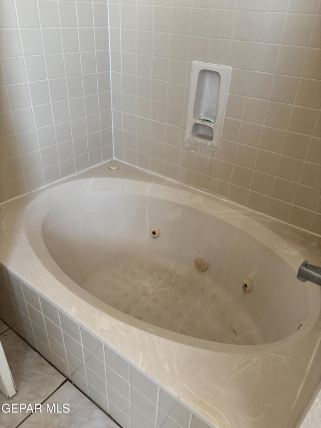 10645 Obsidian St, El Paso, TX 79924 - bathroom with a jetted tub and tile patterned flooring