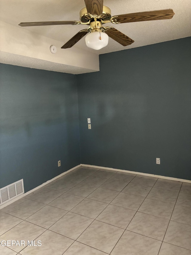 10645 Obsidian St, El Paso, TX 79924 - spare room with ceiling fan, a smoke detector, light tile patterned flooring, and baseboards