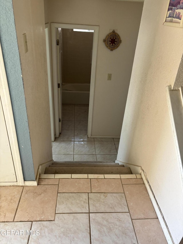 10645 Obsidian St, El Paso, TX 79924 - hall with tile patterned flooring and baseboards
