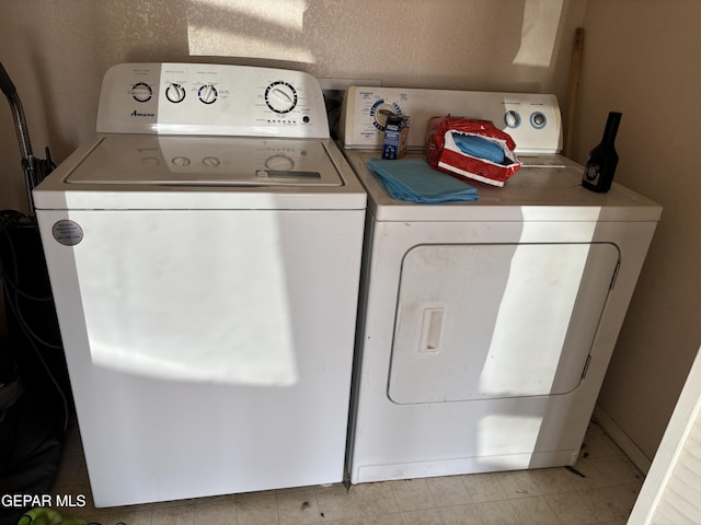 10645 Obsidian St, El Paso, TX 79924 - clothes washing area with independent washer and dryer