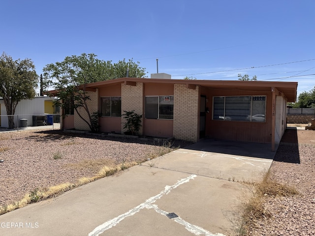 10378 Yellowstone St, El Paso, TX 79924 - view of front of house with brick siding and driveway