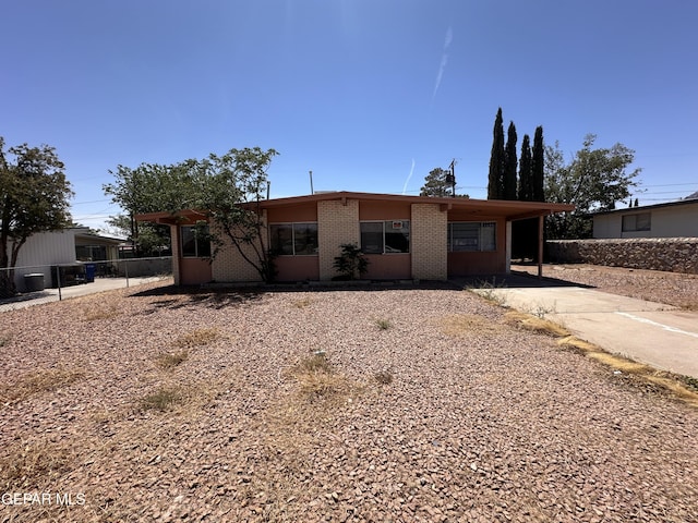 10378 Yellowstone St, El Paso, TX 79924 - view of front of house featuring brick siding and driveway