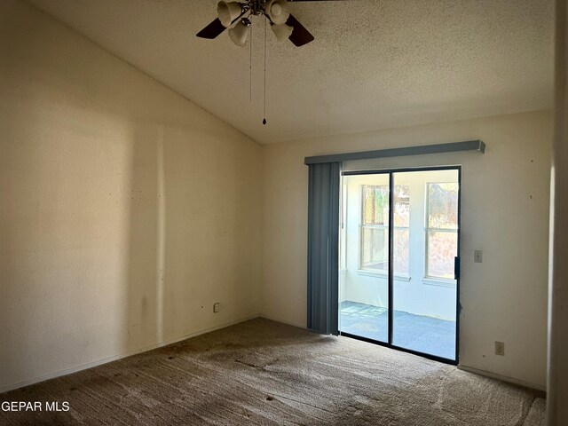spare room with carpet floors, a ceiling fan, and a textured ceiling