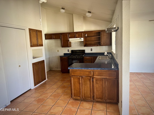 kitchen featuring black range with gas cooktop, a sink, open shelves, dark countertops, and under cabinet range hood