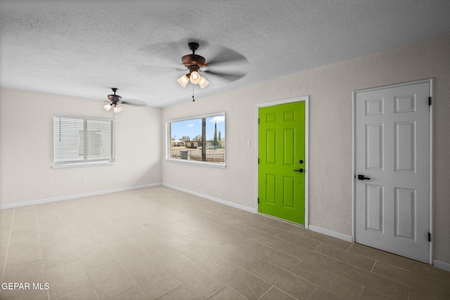 5325 Timberwolf Dr, El Paso, TX 79903 - spare room featuring a ceiling fan and a textured ceiling