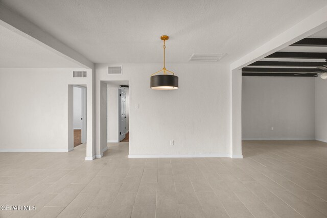 5325 Timberwolf Dr, El Paso, TX 79903 - empty room featuring a textured ceiling and baseboards