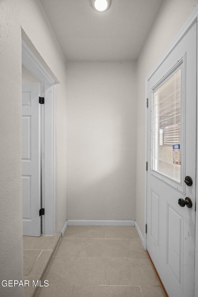 5325 Timberwolf Dr, El Paso, TX 79903 - entryway with light tile patterned flooring and baseboards
