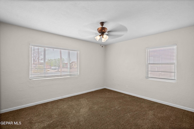 5325 Timberwolf Dr, El Paso, TX 79903 - empty room with dark colored carpet, baseboards, and a ceiling fan