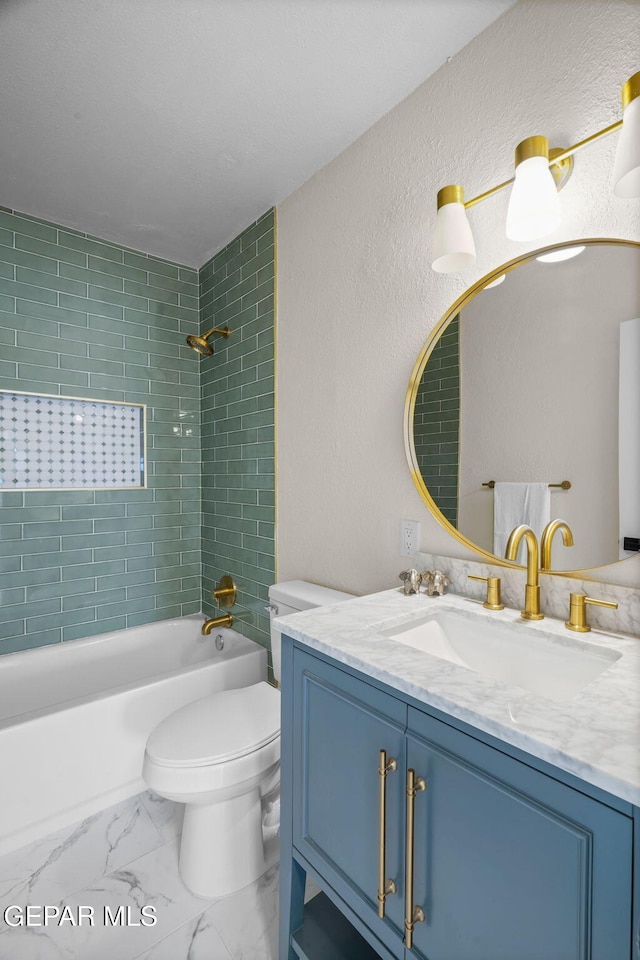 5325 Timberwolf Dr, El Paso, TX 79903 - bathroom featuring shower / bath combination, toilet, vanity, marble look tile flooring, and a textured wall