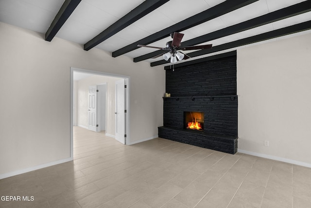 5325 Timberwolf Dr, El Paso, TX 79903 - unfurnished living room featuring beamed ceiling, a ceiling fan, a fireplace, and baseboards