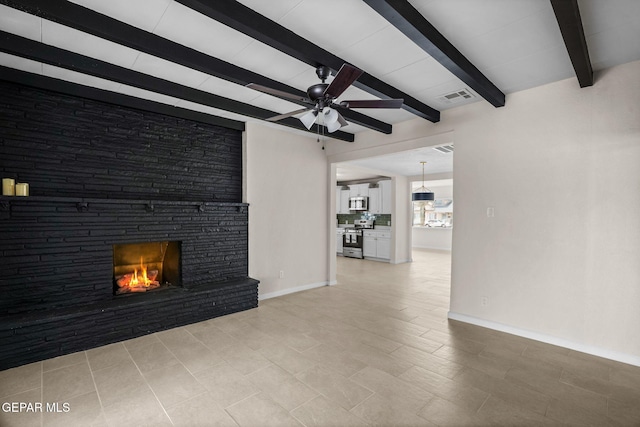 5325 Timberwolf Dr, El Paso, TX 79903 - unfurnished living room with ceiling fan, a fireplace, beamed ceiling, and baseboards