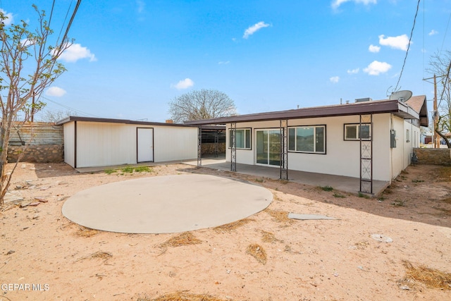 5325 Timberwolf Dr, El Paso, TX 79903 - rear view of property with a patio, fence, an outdoor structure, and stucco siding