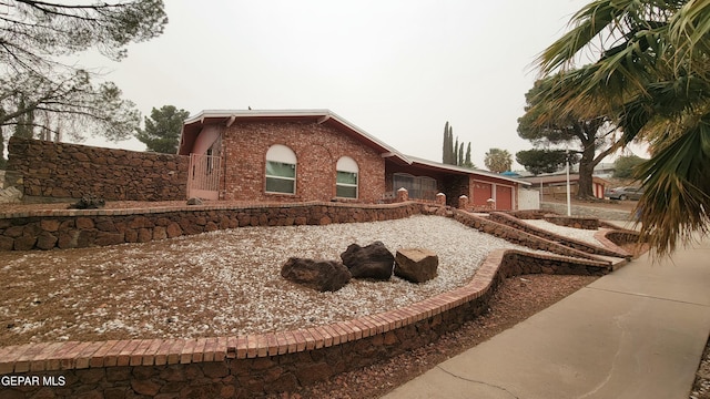 1523 Vista Real Dr, El Paso, TX 79935 - back of property with brick siding and fence