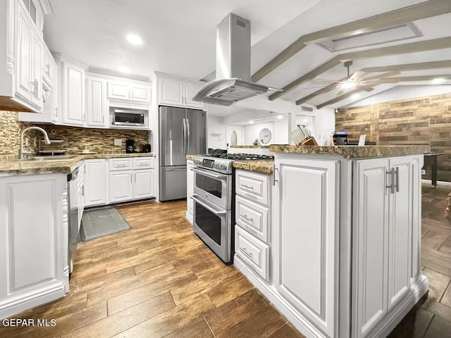 1523 Vista Real Dr, El Paso, TX 79935 - kitchen featuring stainless steel appliances, island exhaust hood, ceiling fan, white cabinets, and a sink