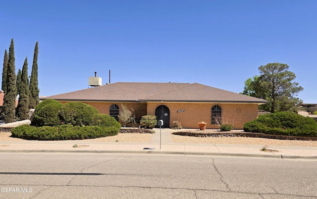 view of front of house featuring brick siding