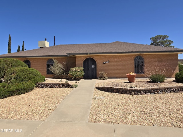 ranch-style home with brick siding