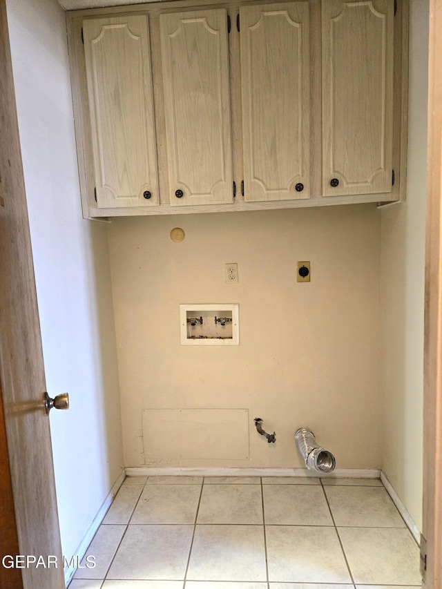 laundry room with hookup for a gas dryer, hookup for a washing machine, cabinet space, hookup for an electric dryer, and light tile patterned floors