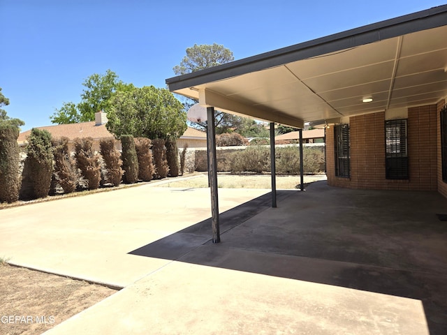 view of patio featuring fence