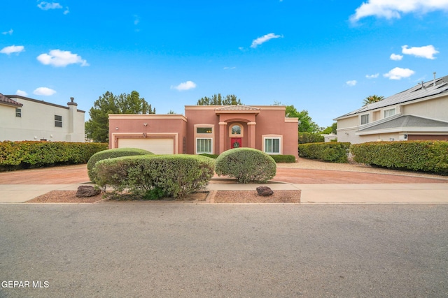 421 Wild Willow Dr, El Paso, TX 79922 - view of front of property featuring driveway, a garage, and stucco siding
