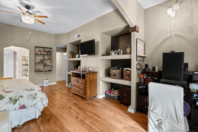 421 Wild Willow Dr, El Paso, TX 79922 - bedroom featuring wood finished floors, arched walkways, and baseboards