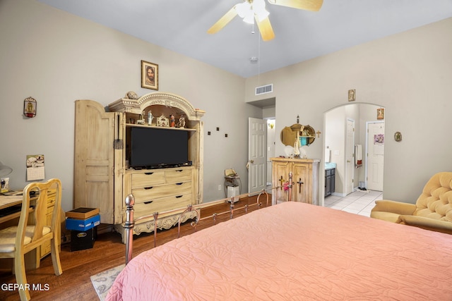 421 Wild Willow Dr, El Paso, TX 79922 - bedroom featuring light wood-style floors, arched walkways, ceiling fan, and ensuite bath