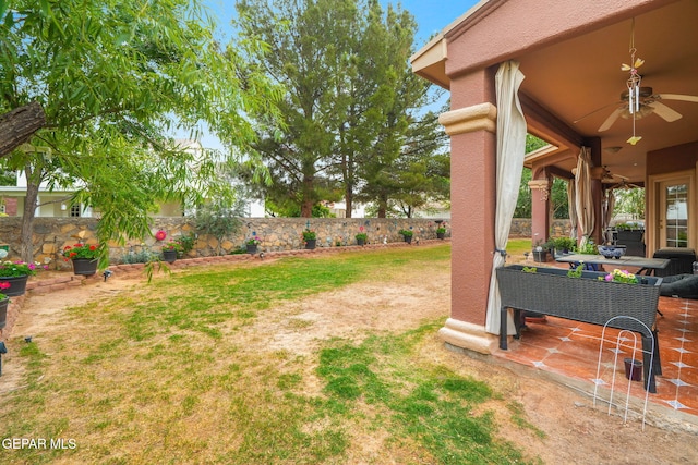 421 Wild Willow Dr, El Paso, TX 79922 - fenced backyard with a ceiling fan and a patio area