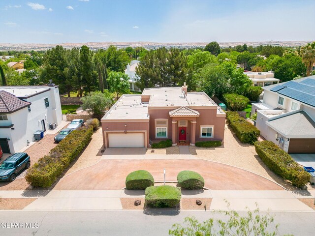 421 Wild Willow Dr, El Paso, TX 79922 - mediterranean / spanish-style home featuring curved driveway, stucco siding, and a garage