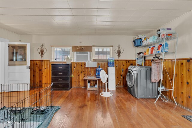 8715 Lawson St, El Paso, TX 79904 - miscellaneous room featuring a wainscoted wall, washer / dryer, wooden walls, and wood finished floors