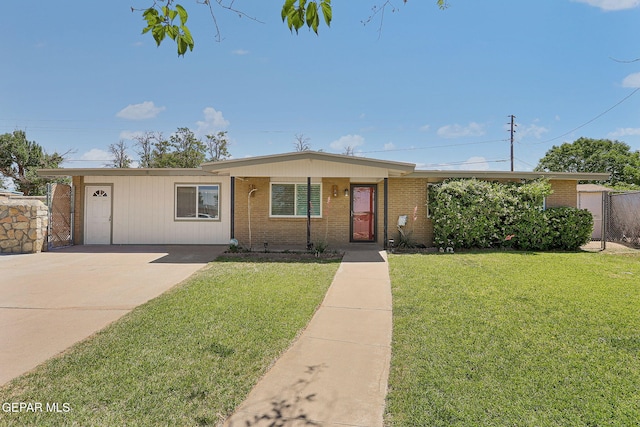 4540 Swan Dr, El Paso, TX 79922 - single story home featuring brick siding, a front yard, and driveway