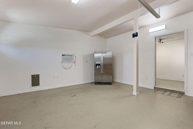 4540 Swan Dr, El Paso, TX 79922 - garage featuring stainless steel fridge with ice dispenser, a wall mounted AC, and baseboards
