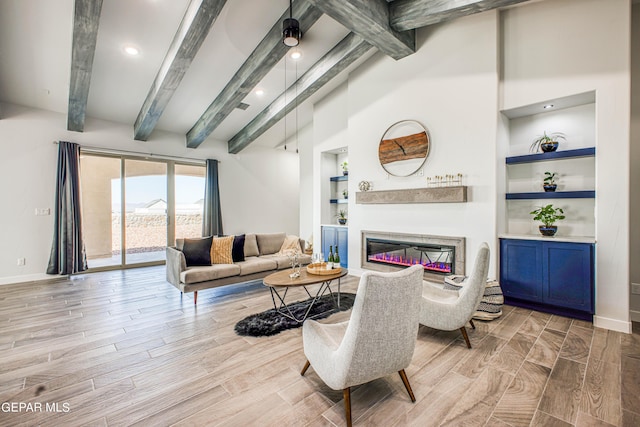 309 Blue Vly, El Paso, TX 79928 - living room with wood finished floors, built in features, baseboards, a glass covered fireplace, and recessed lighting