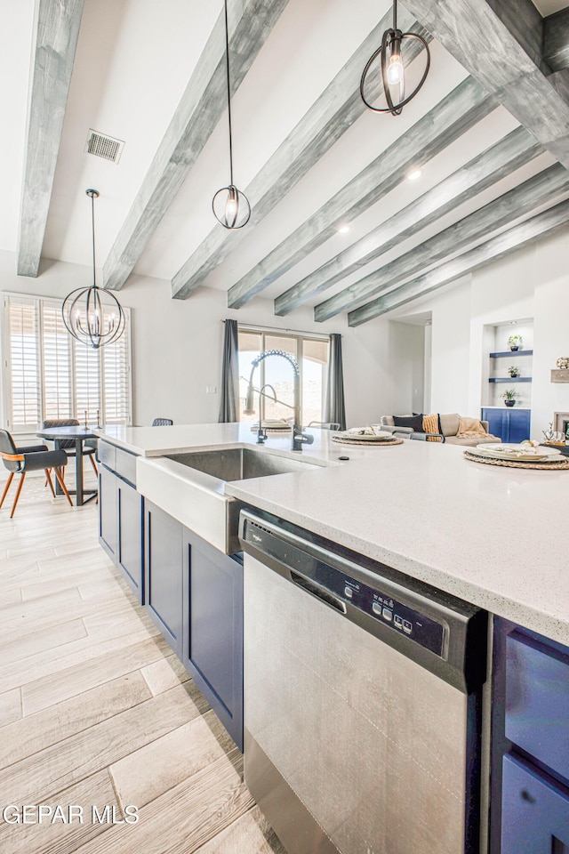 309 Blue Vly, El Paso, TX 79928 - kitchen featuring stainless steel dishwasher, open floor plan, beamed ceiling, a sink, and light wood-style flooring