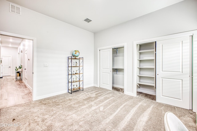 309 Blue Vly, El Paso, TX 79928 - unfurnished bedroom with multiple closets, carpet floors, and baseboards